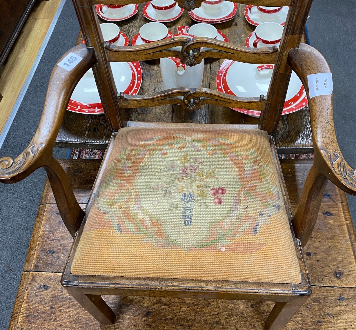 A George III style child's ladderback elbow chair, width 45cm, depth 32cm, height 65cm